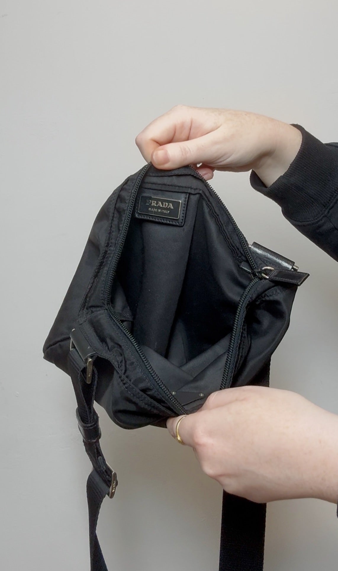 Black Prada Tessuto nylon crossbody bag with logo plaque and adjustable strap