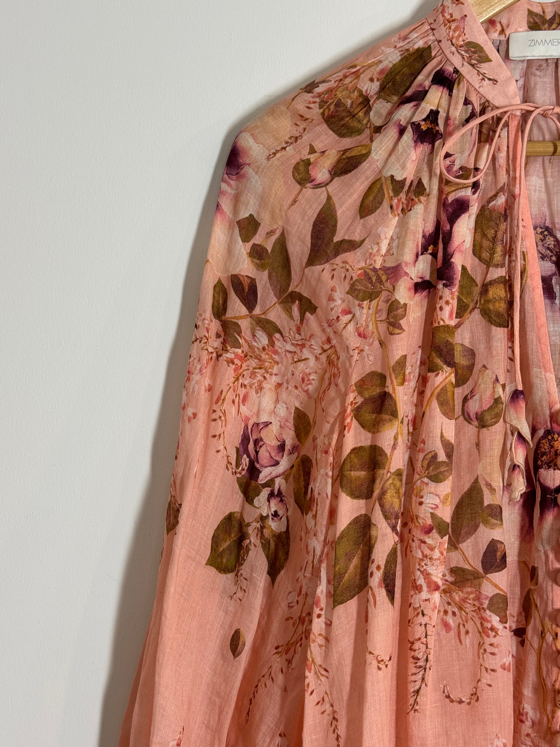 Floral patterned Zimmermann blouse on a white background